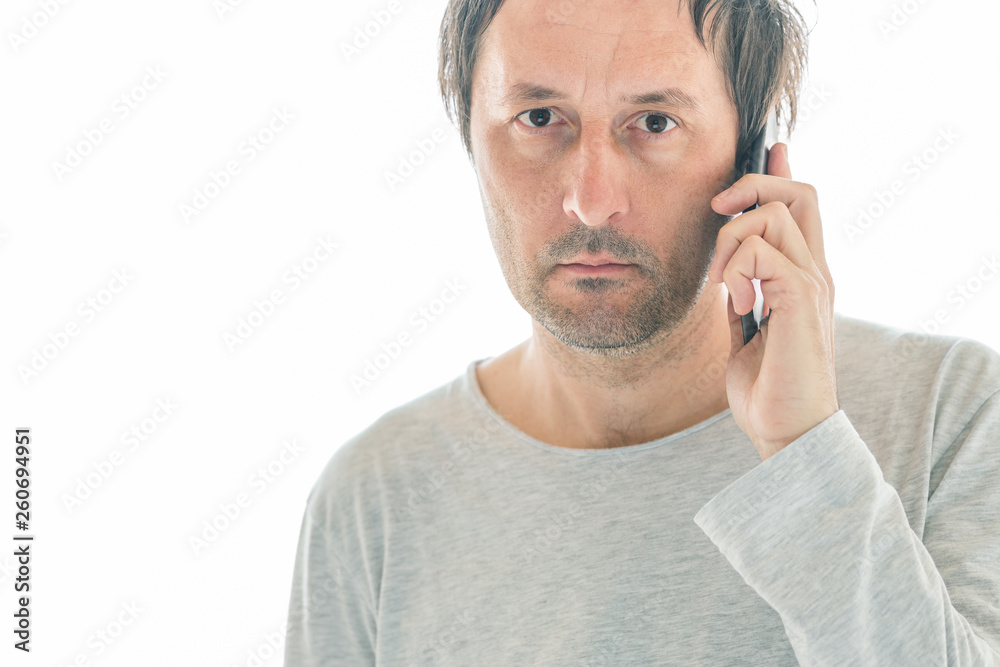 Handsome man using mobile phone isolated on white background Handsome man using mobile phone isolated on white background