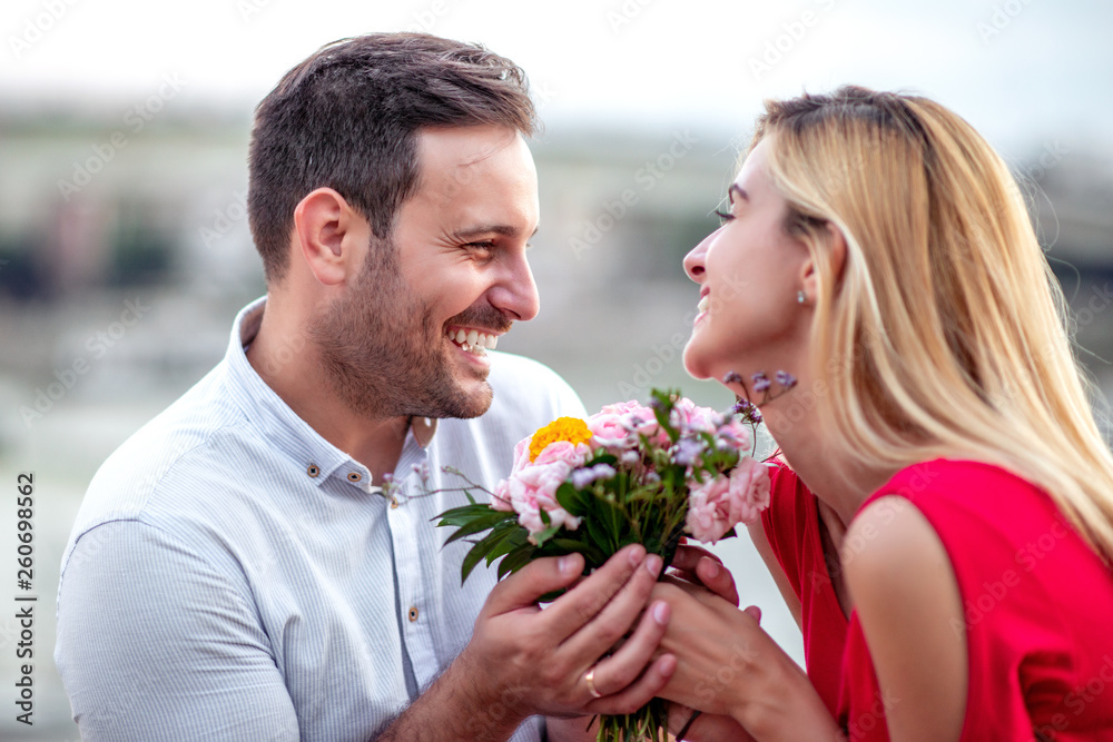 Young romantic couple with flowers