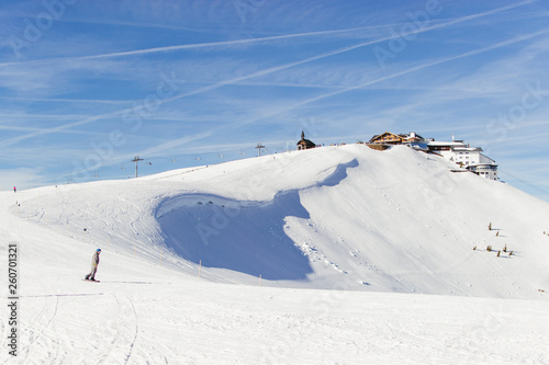 Snowboarder on the ski slopes in the Alps 