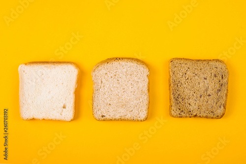 A selection of toast bread for breakfast. Minimalism on yellow