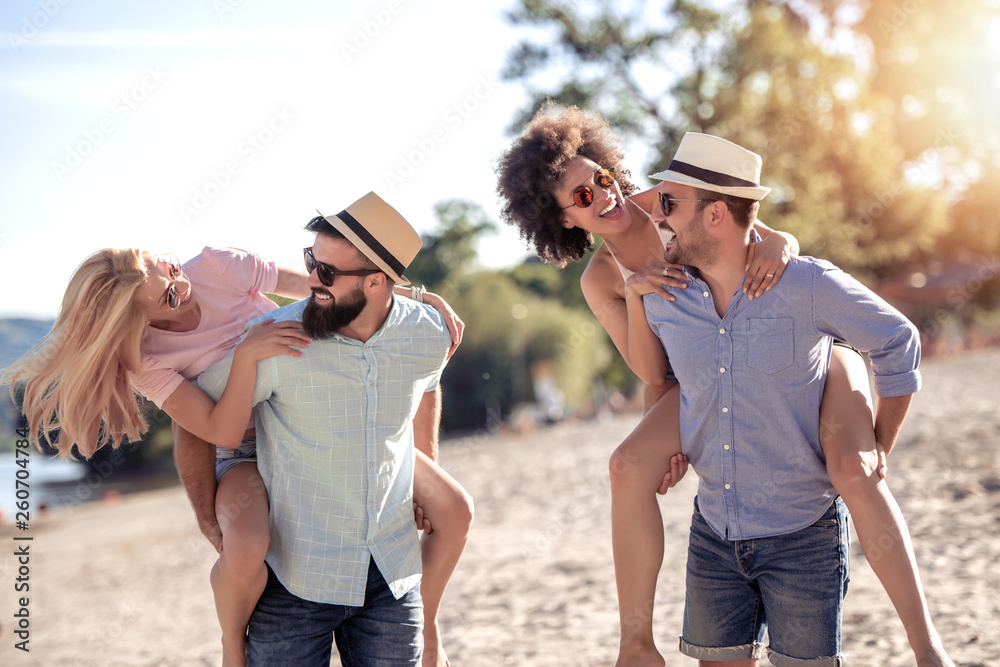 Group of happy young people on the beach