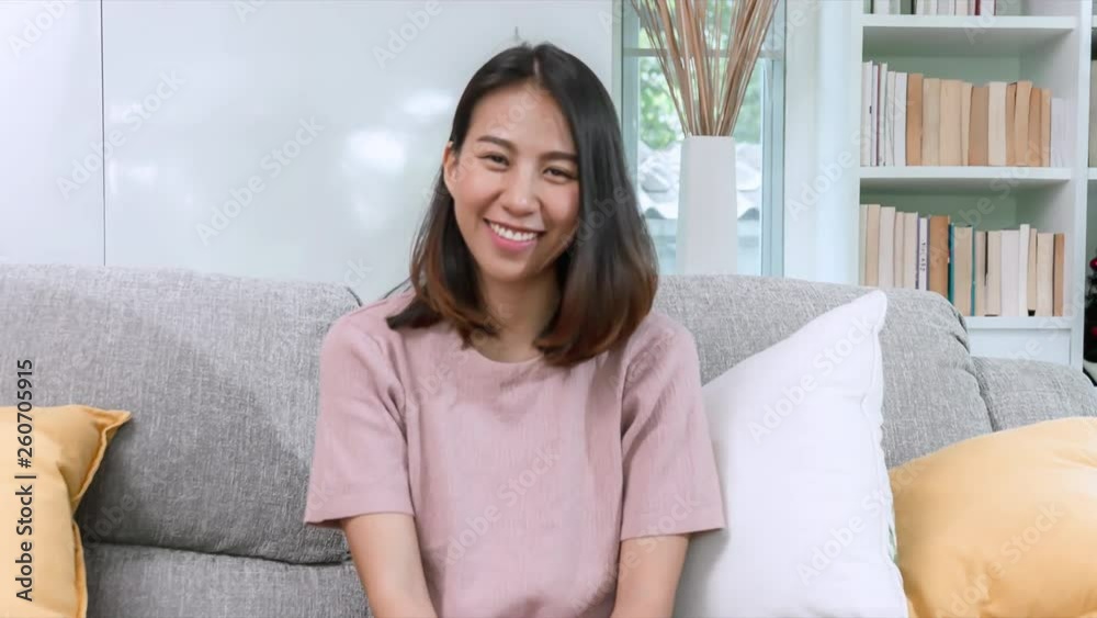 Young Asian Woman Happy Watching TV at home. Young Asian Woman Happy Watching TV at home.