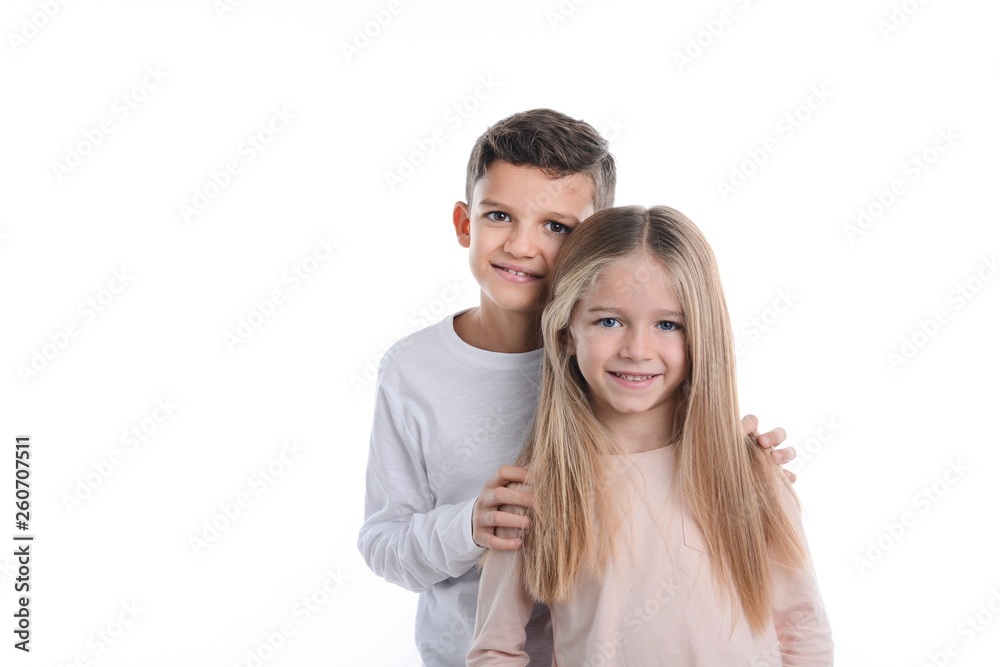 portrait of two young kids boy and girl sibling in studio shot on white background portrait of two young kids boy and girl sibling in studio shot on white background