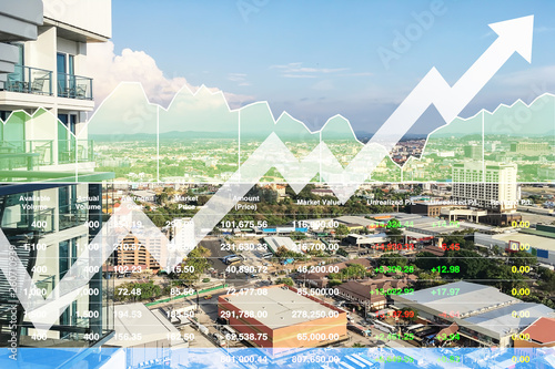 Stock financial index of successful investment on property real estate business and construction industry with graph and chart on city background.