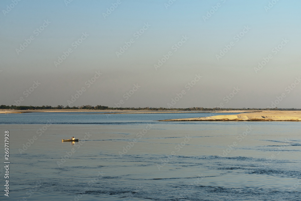View on small fishing boat and Majuli Island  the world's biggest River Island, Assam India.