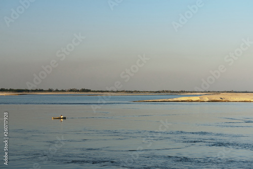 View on small fishing boat and Majuli Island  the world's biggest River Island, Assam India.