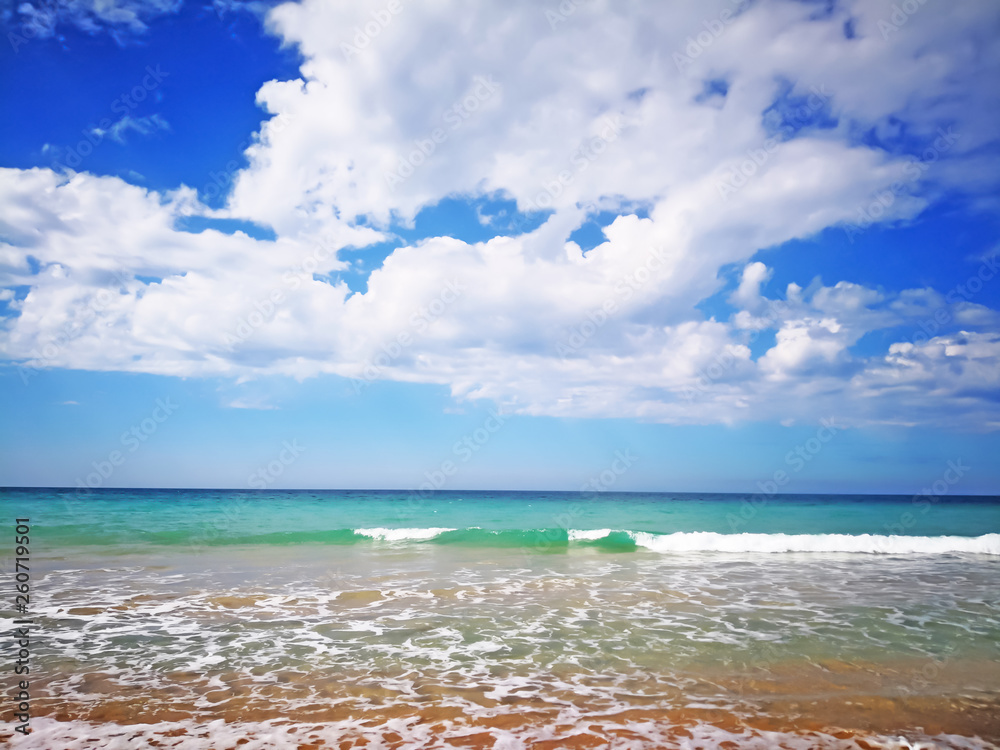 Summer beach with blue sea and waves, amazing blue sky with white clouds Summer beach with blue sea and waves, amazing blue sky with white clouds