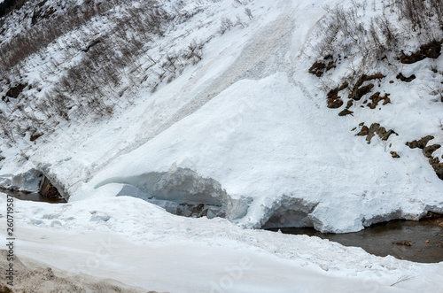 avalanche on the mountain river Gonachkhir in Dombay  Karachay-Cherkessia  Russia