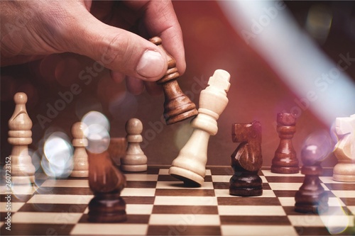 Businessman playing chess close up