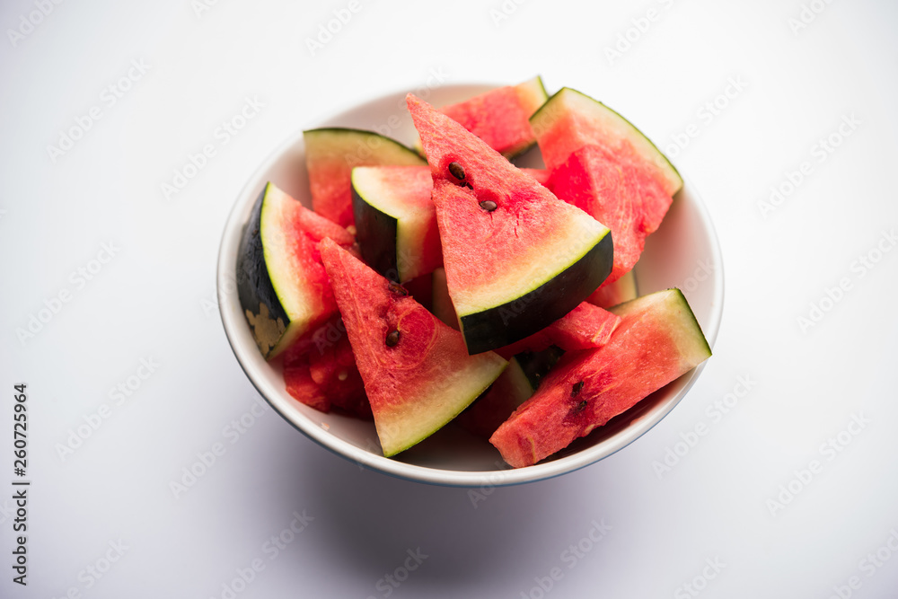 Watermelon / tarbooj fruit cube slices served in a bowl. selective focus Watermelon / tarbooj fruit cube slices served in a bowl. selective focus