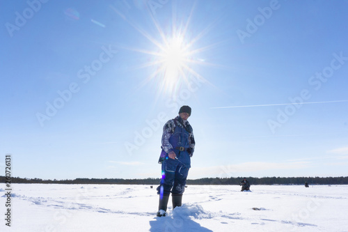 fisherman fishing winter fishing on a bright Sunny day