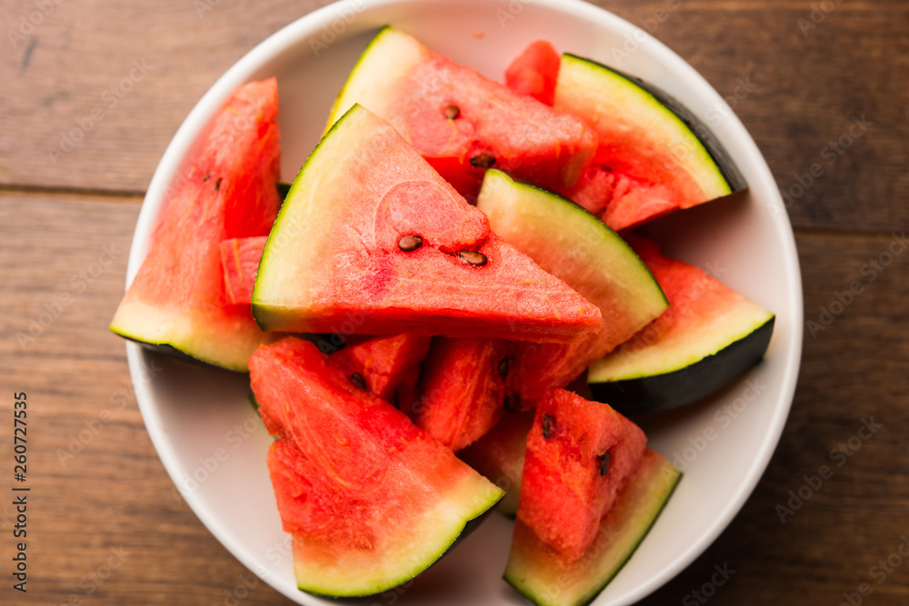 Watermelon / tarbooj fruit cube slices served in a bowl. selective focus Watermelon / tarbooj fruit cube slices served in a bowl. selective focus