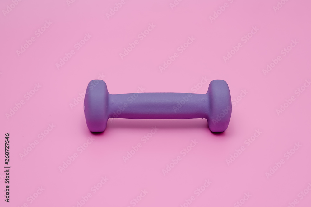 violet dumbbell for fitness on pink background violet dumbbell for fitness on pink background