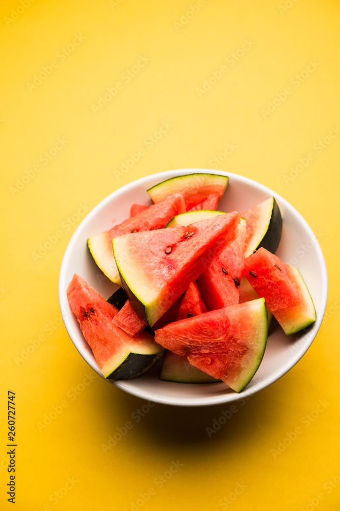 Watermelon / tarbooj fruit cube slices served in a bowl. selective focus Watermelon / tarbooj fruit cube slices served in a bowl. selective focus