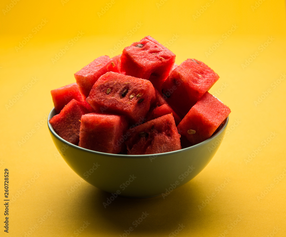 Watermelon / tarbooj fruit cube slices served in a bowl. selective focus Watermelon / tarbooj fruit cube slices served in a bowl. selective focus