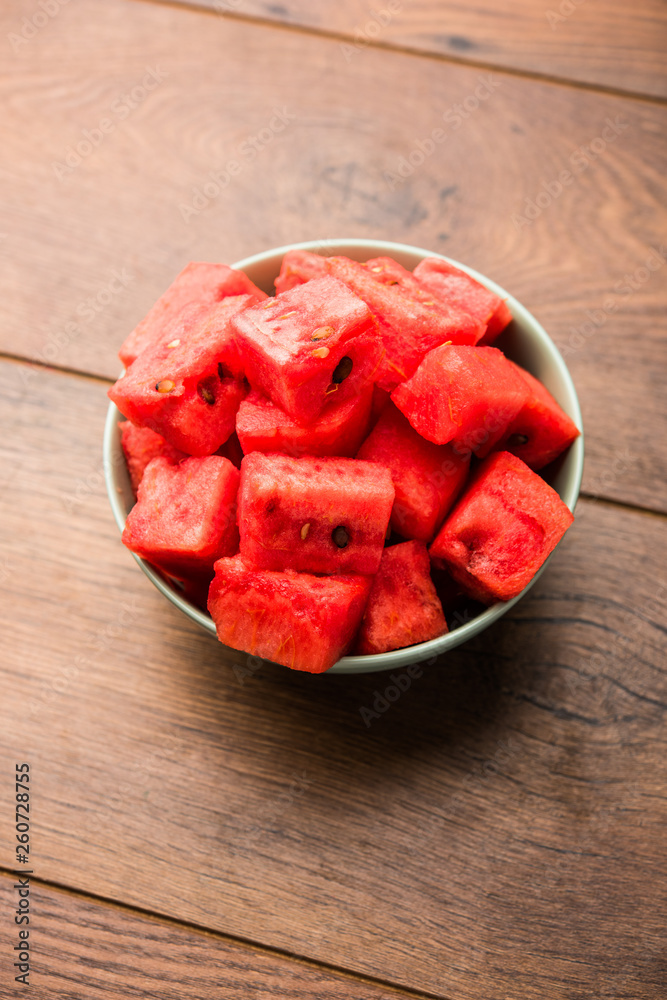 Watermelon / tarbooj fruit cube slices served in a bowl. selective focus Watermelon / tarbooj fruit cube slices served in a bowl. selective focus