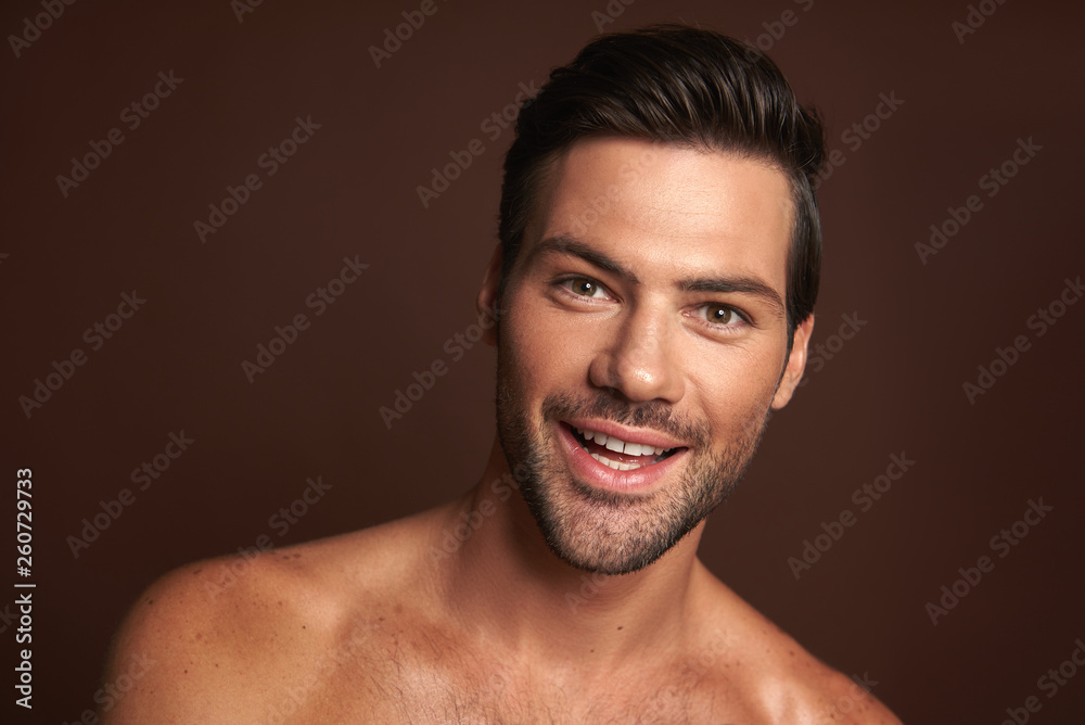 Close up happy smiling muscular male model Close up happy smiling muscular male model