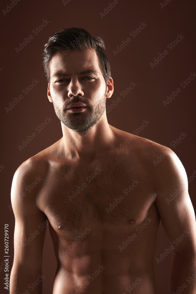 Fototapeta premium Portrait of young handsome muscular naked man