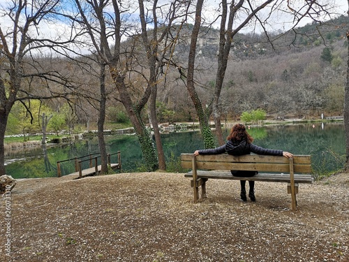 girl on the bench at the lake