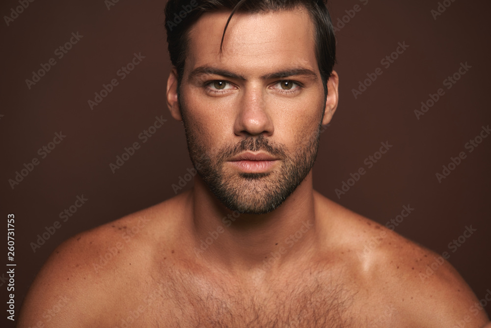 Close up confident young muscular male model Close up confident young muscular male model