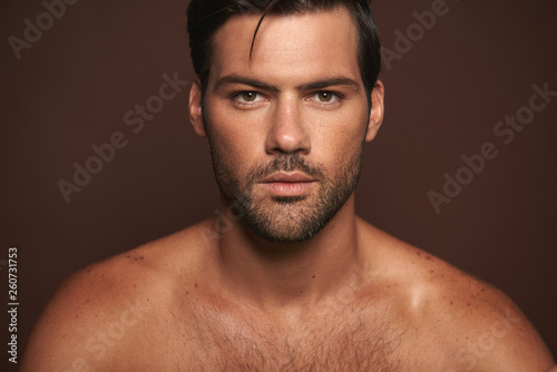 Close up confident young muscular male model photo