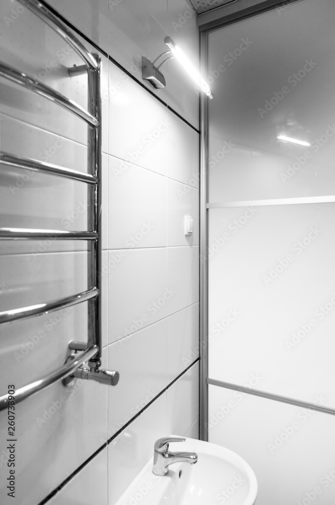 Elements of the bathroom interior-modern design, chrome details, parts of the shower cabin Elements of the bathroom interior-modern design, chrome details, parts of the shower cabin