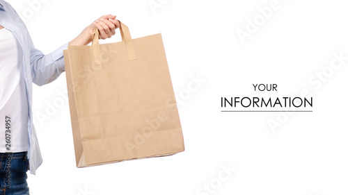 Woman holding a paper bag package shopping beauty pattern on a white background. Isolation © Kabardins photo