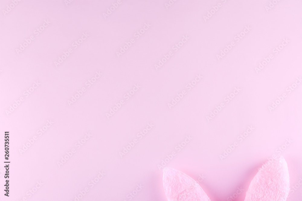 Fluffy Easter bunny ears as symbol of Christian religious holiday. Copy space, close up, flat lay, top view, bright colorful background. Fluffy Easter bunny ears as symbol of Christian religious holiday. Copy space, close up, flat lay, top view, bright colorful background.