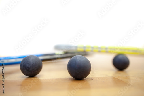 Squash balls scattered on the squash court at the tournament professional player