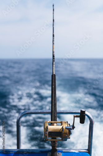fishing rod on blue background