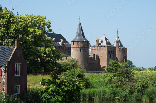 Castle Muiderslot in Muiden, The Netherlands, against blue sky