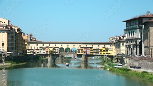 Ancient Ponte Vecchio, medieval old bridge on Arno River with shops built along it in Florence, Tuscany, Italy. Tourism destination in Firenze, sightseeing, Italian holiday, must see in Toscana Region