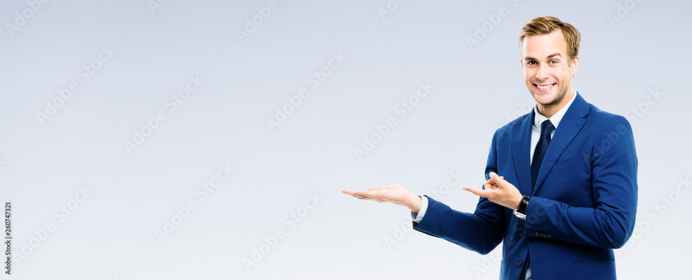 businessman showing something or copyspase businessman showing something or copyspase