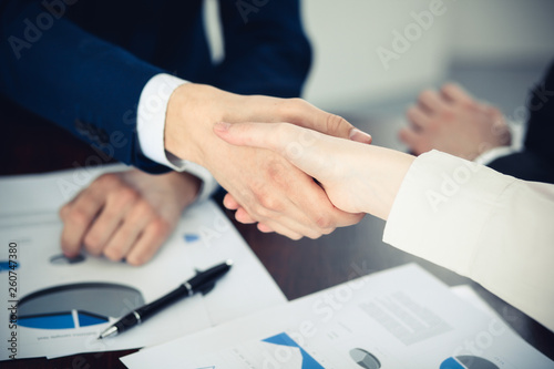 Business people shaking hands finishing up a meeting. Handshake at successful negotiation