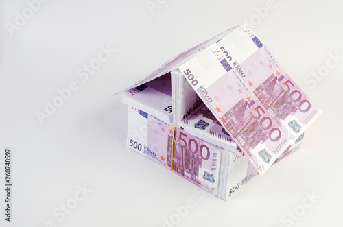 A house made of banknotes, 500 euro bills. Housing construction symbol.  photo