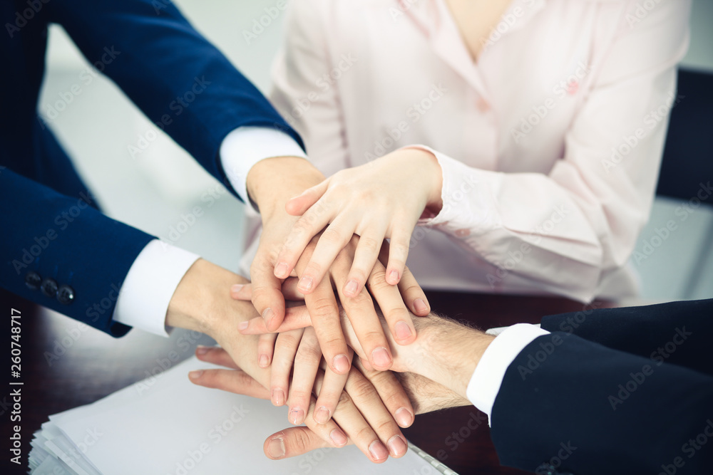 Business people group joining hands. Teamwork or meeting concepts Business people group joining hands. Teamwork or meeting concepts