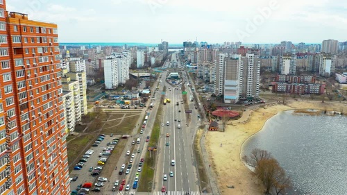 Aerial view of large street cutting through the Kharkivskiy area in Kiev, large house on the left side. photo