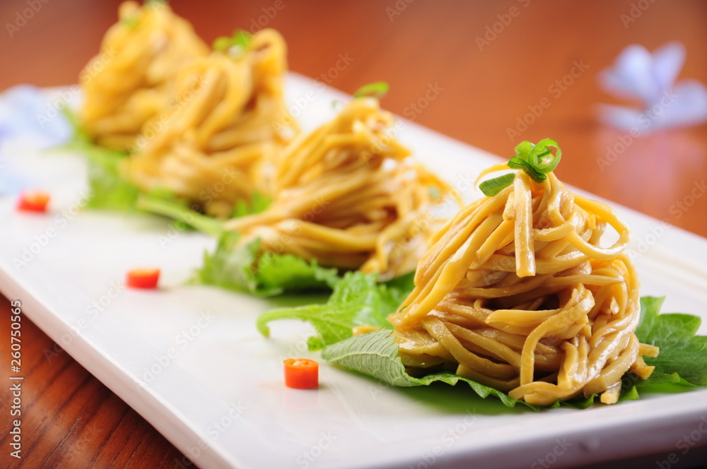 pasta with pesto sauce and basil
