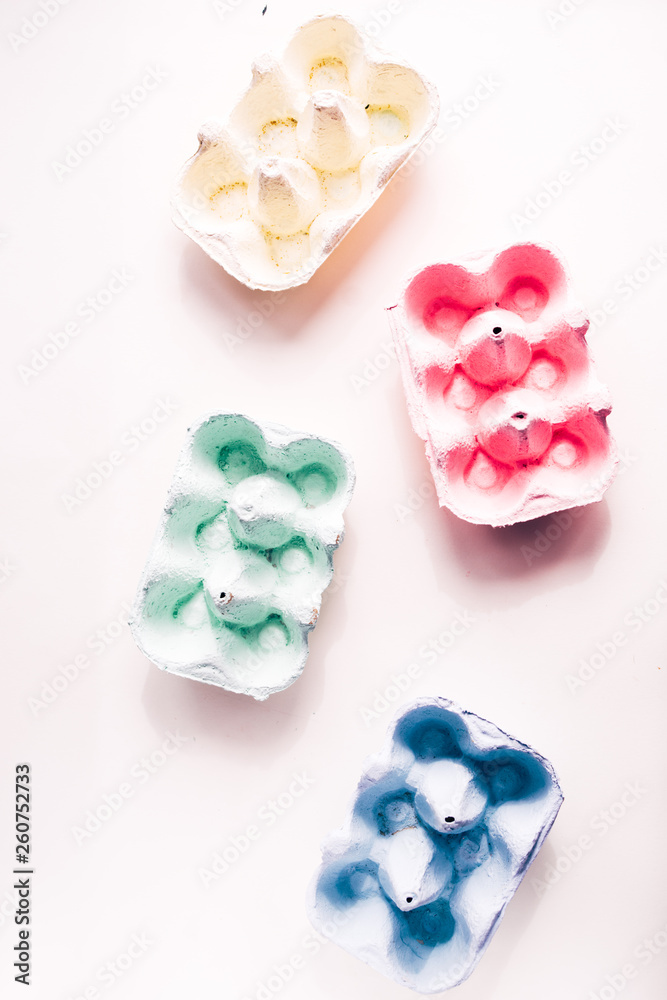 Colored eggs container, easter concept, soft natural direct light Colored eggs container, easter concept, soft natural direct light