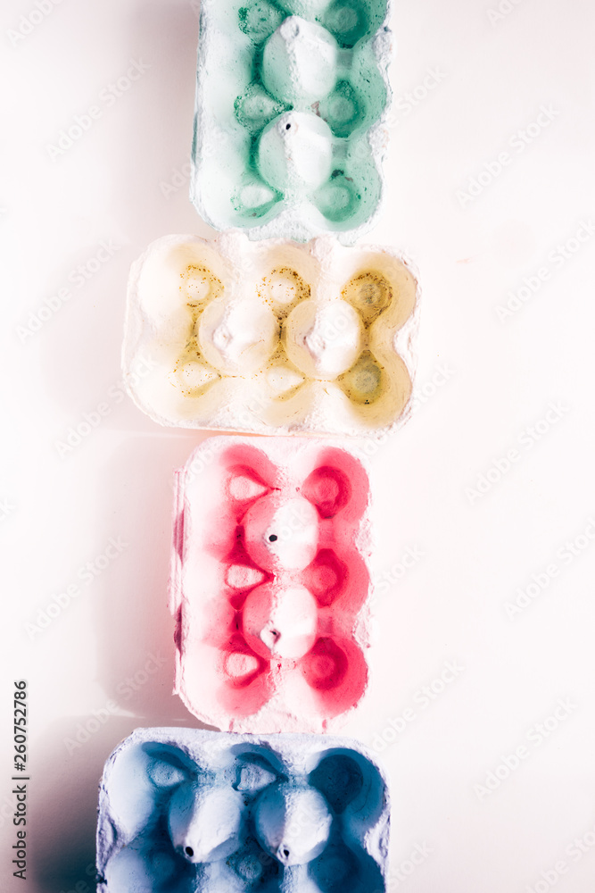 Colored eggs container, easter concept, soft natural direct light Colored eggs container, easter concept, soft natural direct light