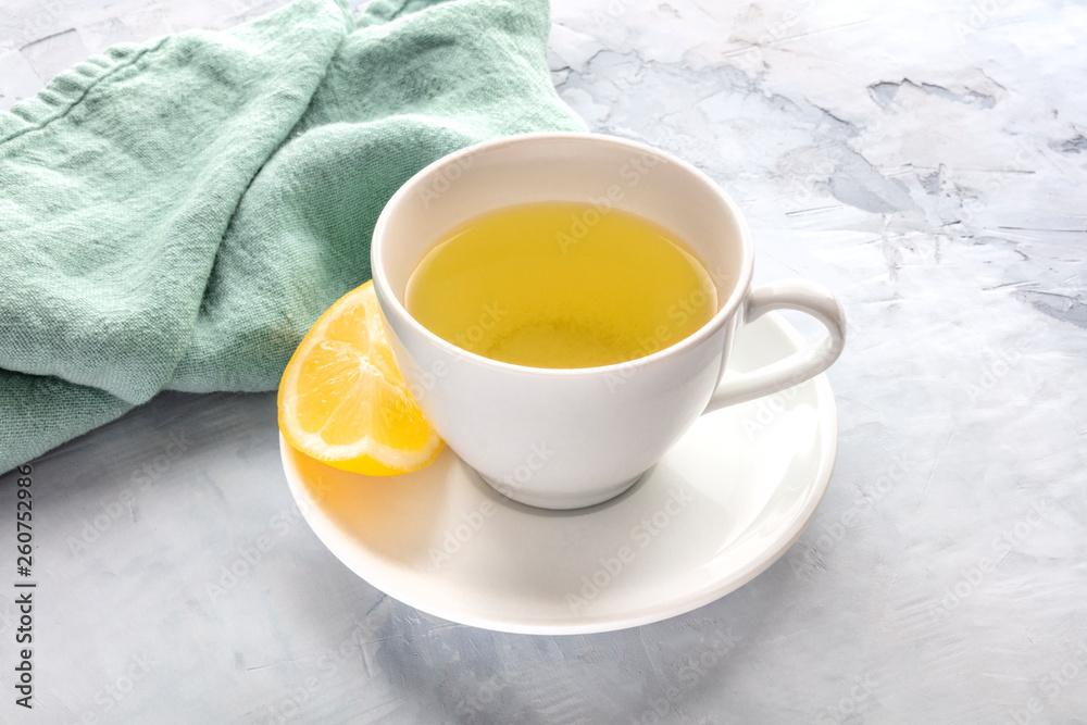 A photo of a cup of tea with lemon and a place for text A photo of a cup of tea with lemon and a place for text