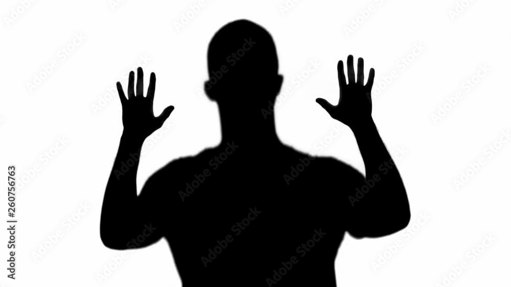 silhouette of man slowly raising hands isolated on white silhouette of man slowly raising hands isolated on white