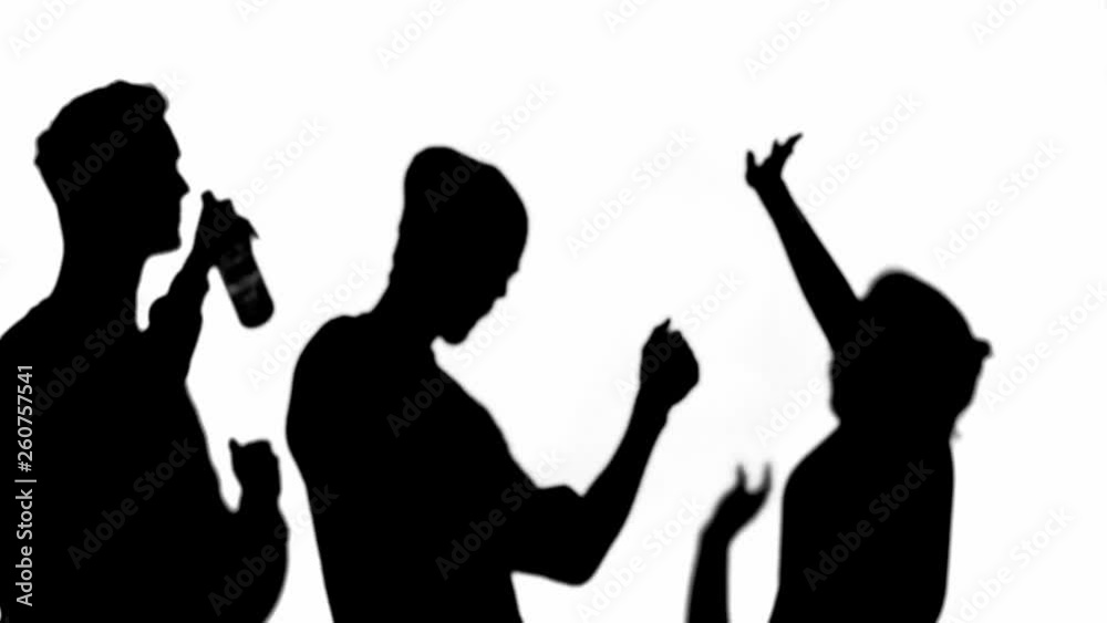 Three silhouettes of friends drinking beer and dancing isolated on white Three silhouettes of friends drinking beer and dancing isolated on white