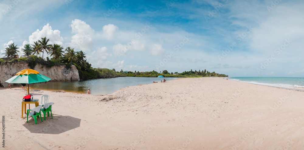 Panoramic view of a lagoon called Maceio in front of the sea separated by a sand bank at Tabatinga beach, Praia de Tabatinga 2, Costa do Conde. Brazilian northeast beach.