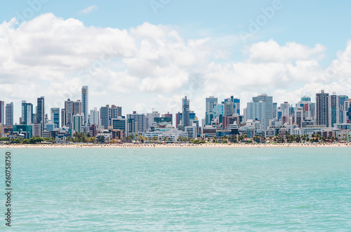 View of the coast, beach and the city on background at Joao Pessoa PB Brazil. Touristic city of Brazilian northeast with beautiful beaches. View from the sea to the city.