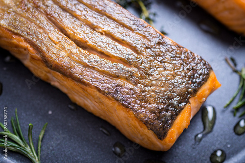 Grilled Salmon Fillets in Frying Pan with Thyme and Garlic