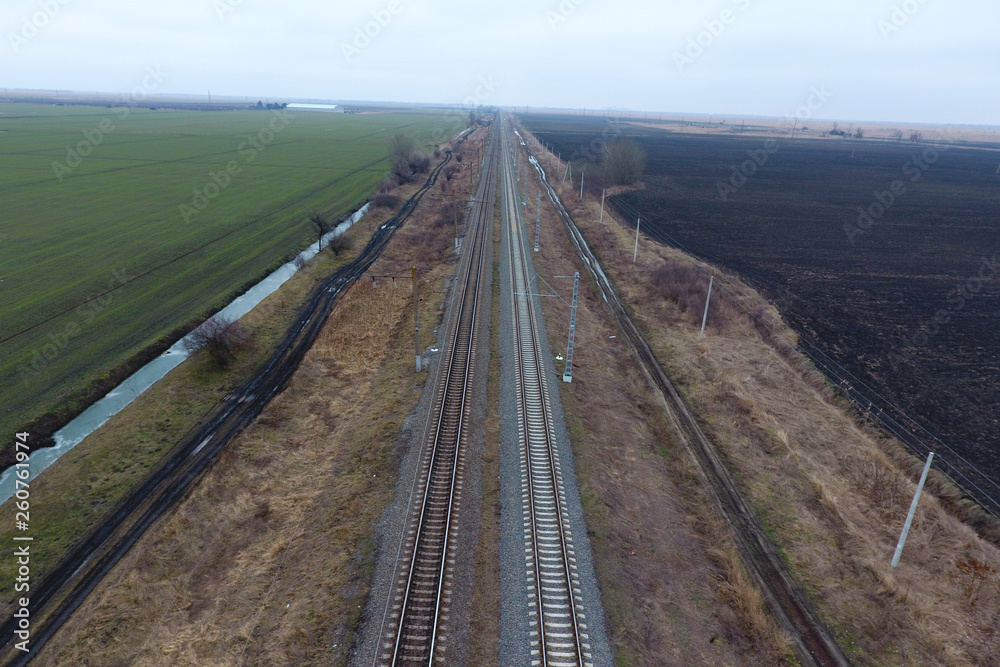 Plot railway. Top view on the rails. High-voltage power lines fo