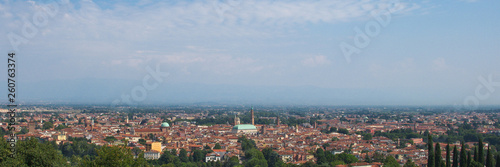 wide panorama of the city of Vicenza and the famous monument called Basilica Palladiana with the tall Clock Tower. Vicenza, Veneto, Italy - April 2019