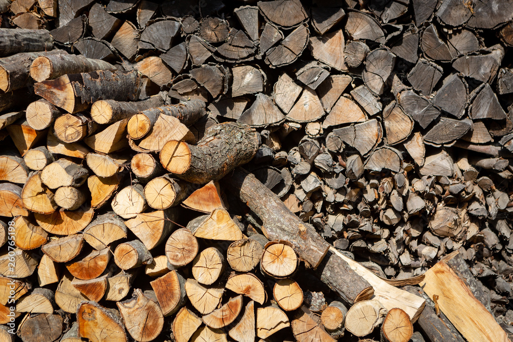 Dried logs for kindling furnace stacked on top of each other. Dried logs for kindling furnace stacked on top of each other.