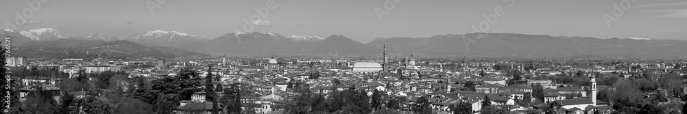 wide panorama of the city of Vicenza and the famous monument called Basilica Palladiana with the tall Clock Tower. Vicenza, Veneto, Italy - April 2019